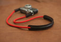 Red climbing rope camera strap with leather shoulder pad