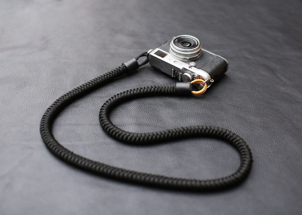 Black and gold woven camera strap